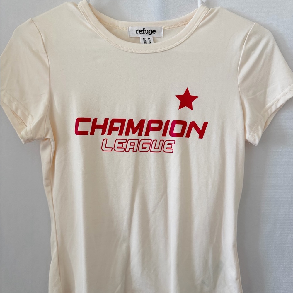 Refuge Cream Champion League Tee with Red Graphic